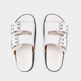 Ganni Wide Welt Chunky Mules 皮质平底穆勒鞋