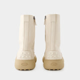 Tod's Winter Gommini 白色亮面小牛皮底短靴