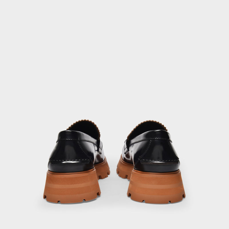 Black leather loafers